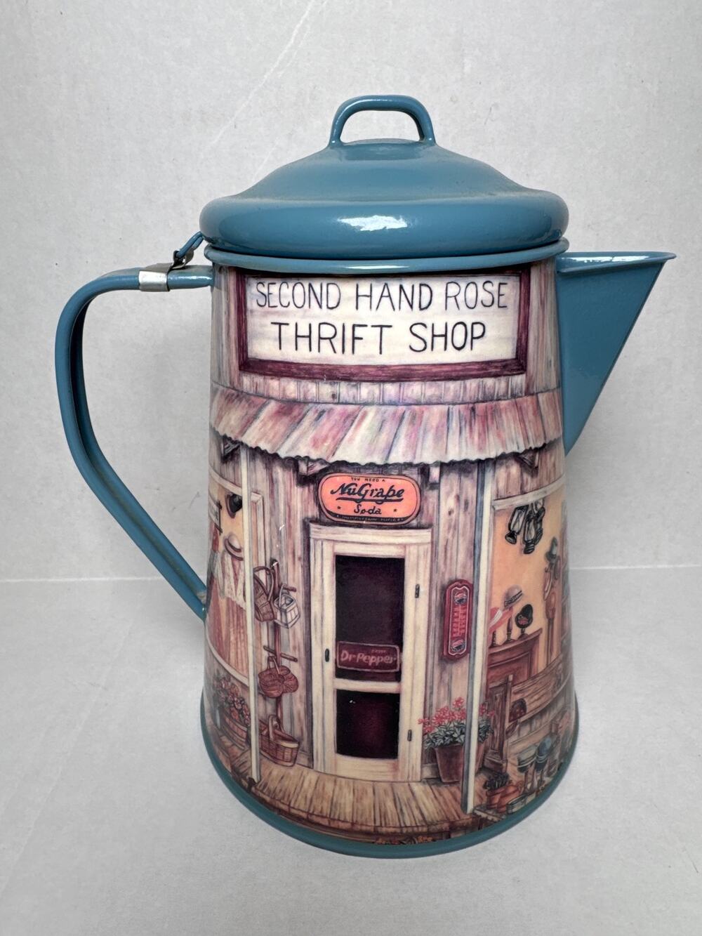 Vintage enamel graniteware blue Coffee Pot with shopping market street